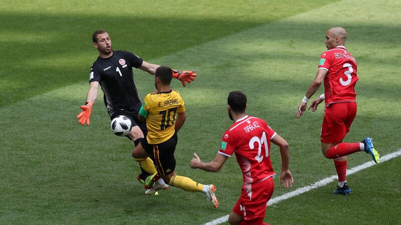 Eden Hazard moves skips past  Farouk Ben Mustapha to score his second aganist Tunisia. Photograph: Catherine Ivill/Getty