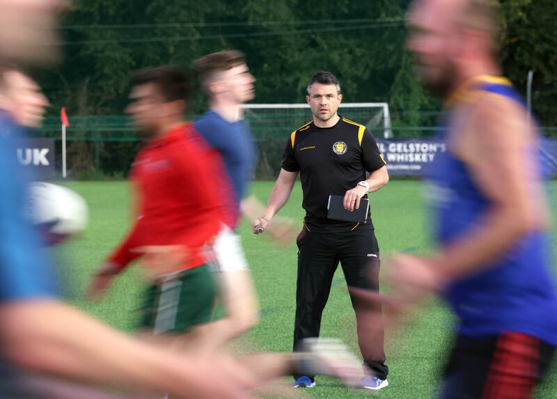 David McGreevey with his players during a training session at the New Forge Lane sports complex in Belfast. Photograph: Stephen Davison