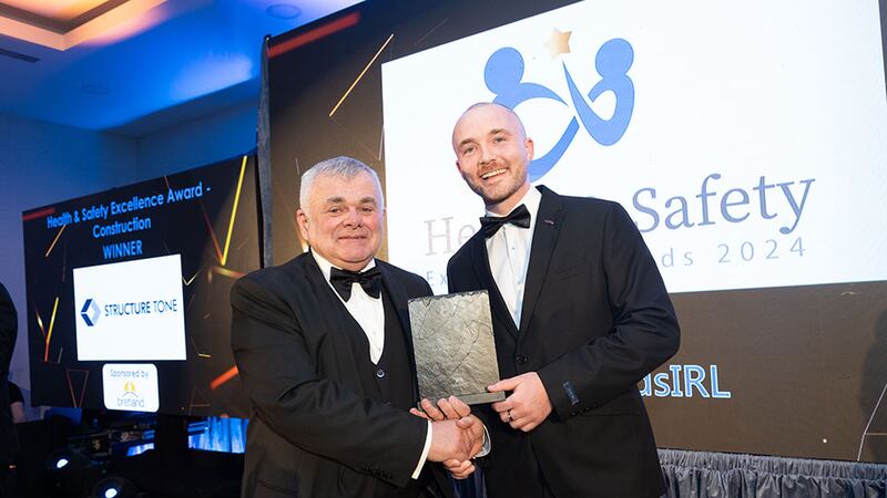 Fechin Daly, managing director at Bretland Construction, presents the health & safety excellence award – construction to Thomas Hickey community lead at Business River in behalf of Structure Tone