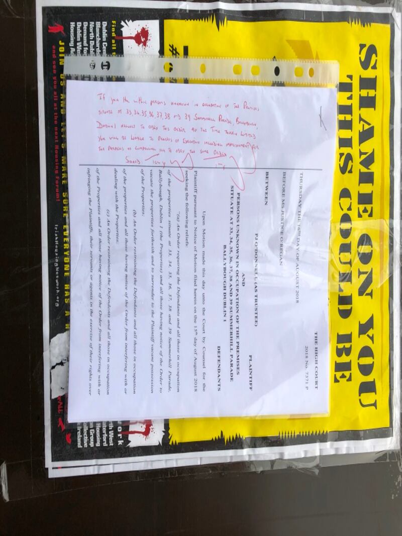 The High Court order on the door of one of the occupied houses. Photograph: Cyril Byrne/The Irish Times