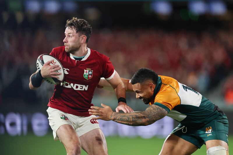 Hugo Keenan of British & Irish Lions is tackled by Ngani Laumape of the AUNZ XV. Photograph: Cameron Spencer/Getty