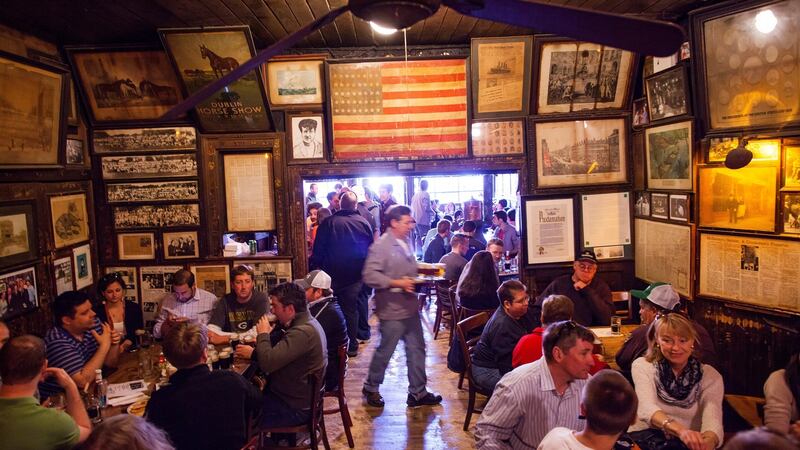 McSorely’s Old Ale House: The busy interior, with its portraits, posters, paraphernalia, stovepipe and sawdust floor, is pretty much as it was a century ago. Photograph: mIchael Nagle