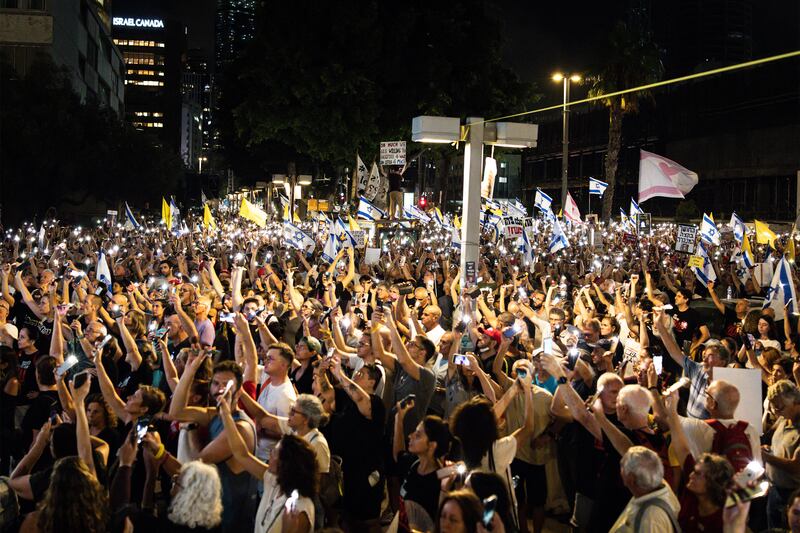 Thousands of demonstrators massed in Tel Aviv on Tuesday as the security cabinet convened. Photograph: John Wessels/AFP 