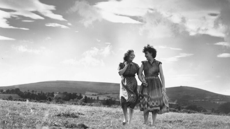 October 8th, 1955: Nora Larkin (right) and Angela O’Connell take a last walk near their home in Kilternan, Co Dublin before emigrating to Britain to search for employment. Photo by Thurston Hopkins/Picture Post/Hulton Archive/Getty Images