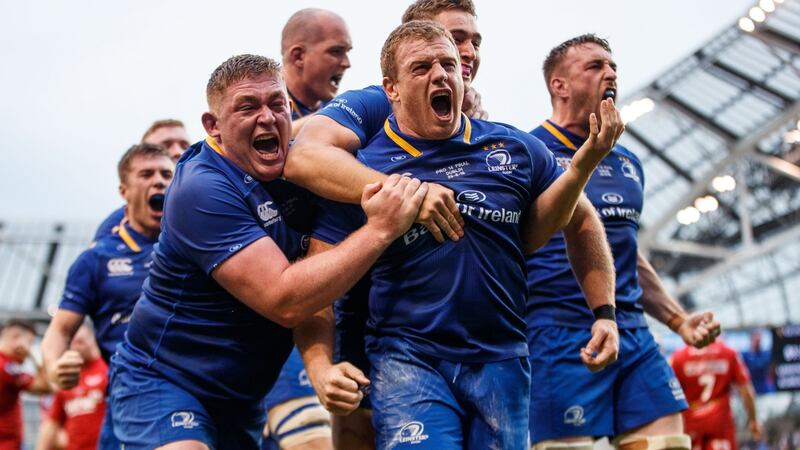 Leinster’s Seán Cronin celebrates scoring his side’s third try with Tadhg Furlong and Jordan Larmour. Photograph: James Crombie/Inpho