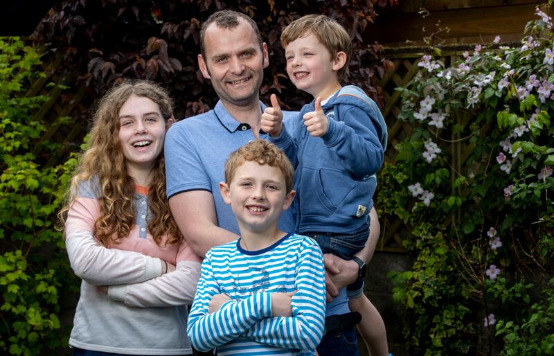 Clive Bowers with his children: 'We [himself and wife Corinna] are both cooking half and half now. It’s important the boys see their dad doing stuff in the house.' Photograph: Tom Honan