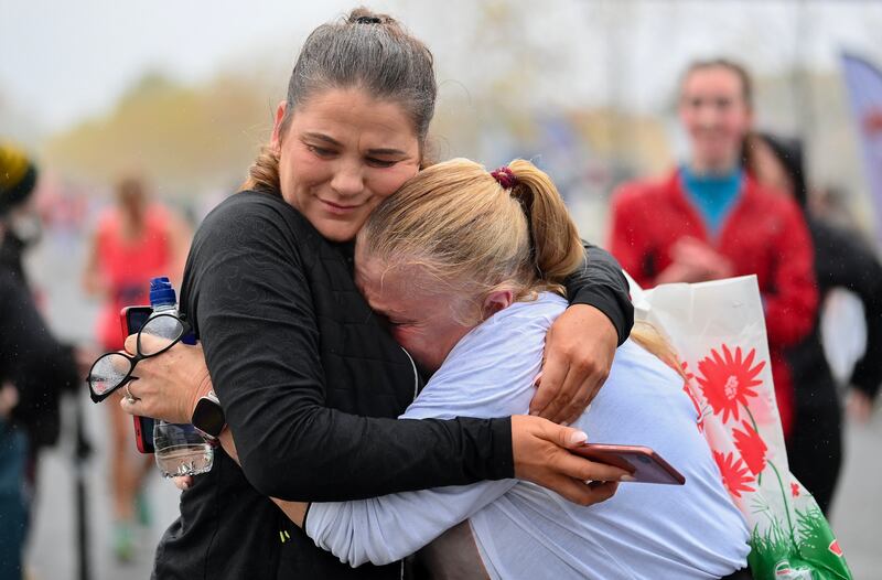 Paula Spain from Dublin, left, comforts Pauline Spain, who ran in remembrance of baby Tony Spain, at the finish line of the Remembrance Run. Photograph: Brendan Moran/Sportsfile