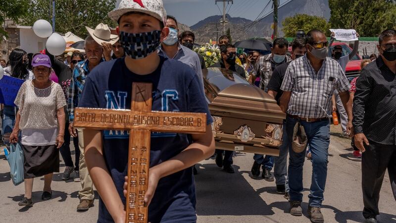 The coffin holding Debanhi Escobar is carried on April 23rd, the day of her funeral in Galeana, Mexico. Photograph: Alejandro Cegarra/New York Times