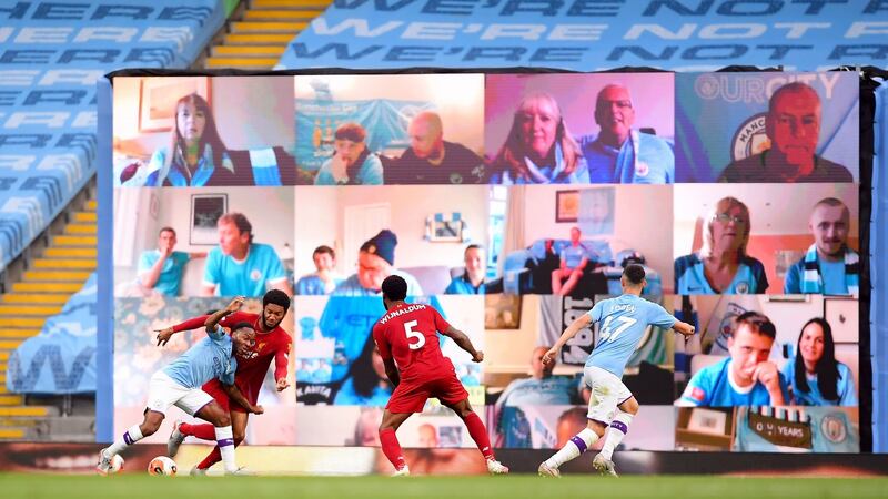 Raheem Sterling is fouled by Joe Gomez to earn Manchester City a penalty against Liverpool. Photograph: Laurence Griffiths/PA