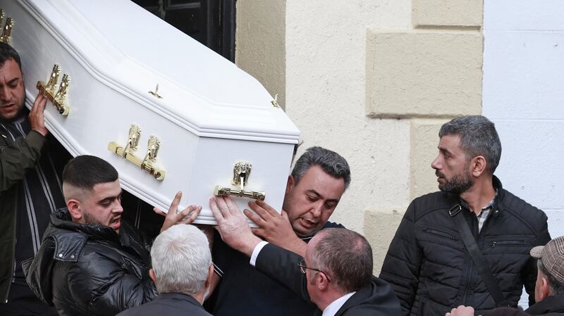 The coffin carrying the remains of Dlava Mohamed (16) is carried out of the family home in Clones, Co Monaghan. Photograph: Liam McBurney/PA Wire