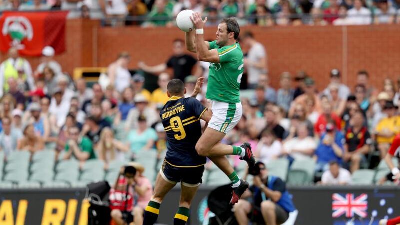 Ireland’s Michael Murphy gets above  Shaun Burgoyne of Australia to take the ball during the first Test  at the Adelaide Oval. Photograph:   Tommy Dickson/Inpho