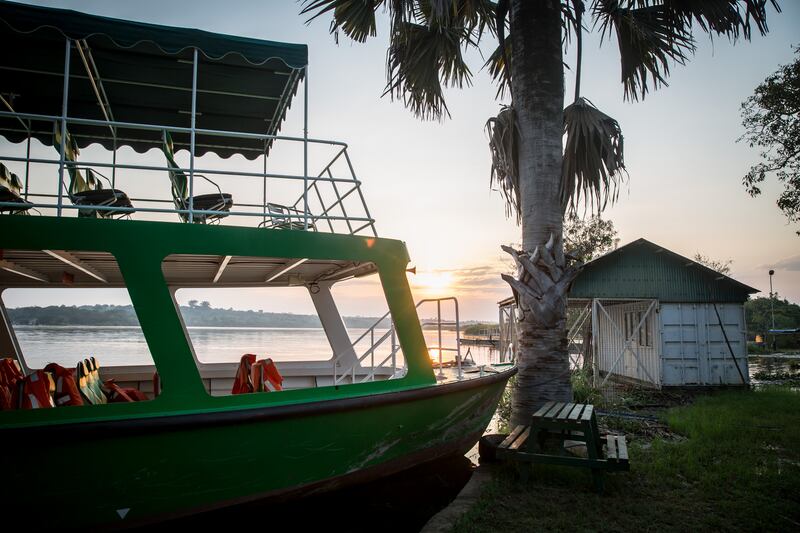 A tourist cruise boat is parked empty at the ferry point on the Nile river, at Murchison Falls, Uganda’s biggest national park. Photograph: Sally Hayden