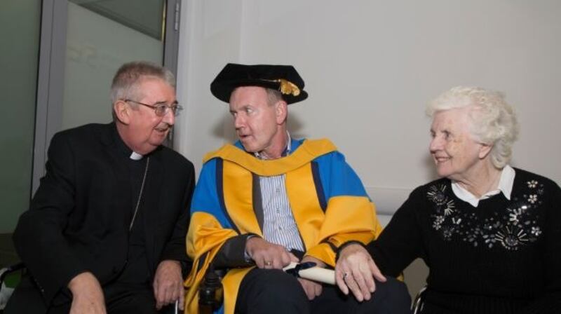 Fr Tony Coote was conferred with an honorary doctorate of science by UCD last December. He is pictured here with Archbishop of Dublin Dr Diarmuid Martin and his mother Patricia. Photograph: Colm Mahady/Fennells