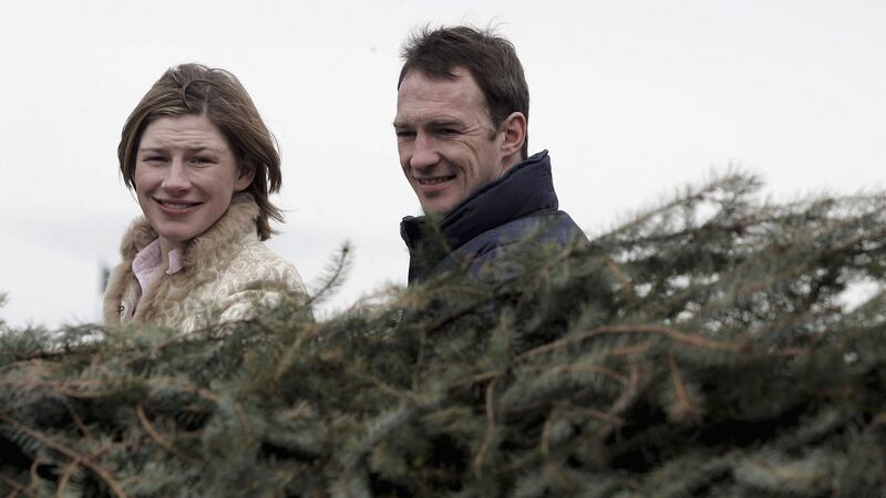 Paul Carberry, a Grand National  winning jockey, shows his sister Nina around The Water Jump at Aintree in 2006. Photograph: Julian Herbert/Getty Images