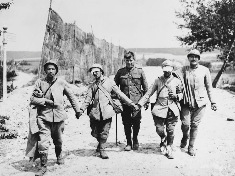 French infantrymen, blinded probably by gassing, are escorted by a British soldier after the second battle of the Marne during the second World War. Photograph: Hulton-Deutsch Collection/Corbis via Getty Images