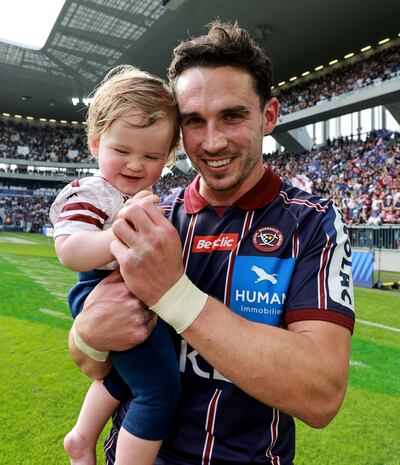 A delighted Joey Carbery with his son after his side, Bordeaux Bègles, beat Toulouse in the Champions Cup semi–final. Photograph: Dan Sheridan/Inpho