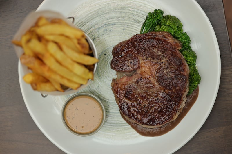 Rib-eye steak with caramelised onion puree and tenderstem broccoli