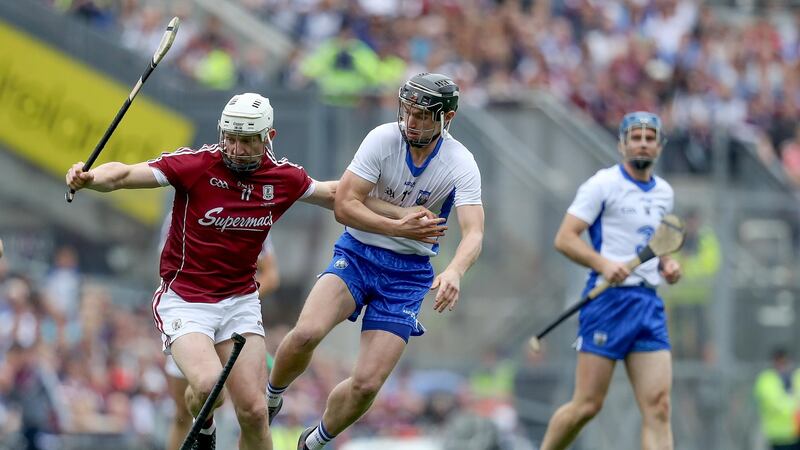 Joe Canning holds off Pauric Mahony. Photograph: Tommy Dickson/Inpho