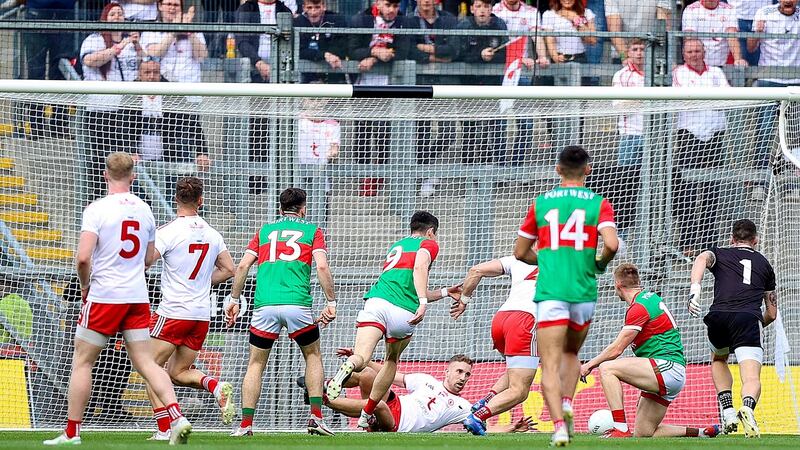 Tyrone’s Niall Sludden blocks the ball on the line to deny Conor Loftus a goal. Photograph: Tommy Dickson/Inpho