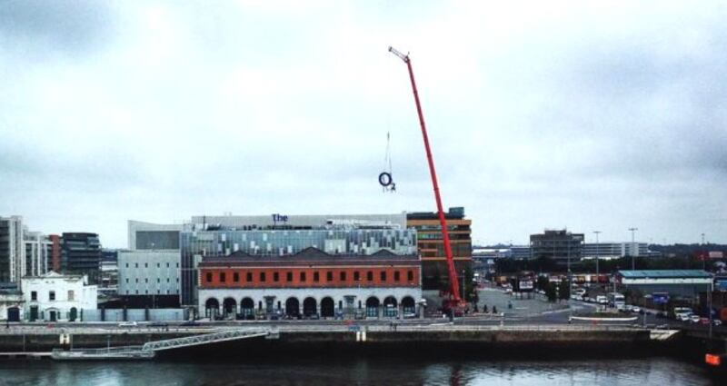 A crane removing the O2 sign from the Dublin venue this morning. Photograph: Daniel Flynn
