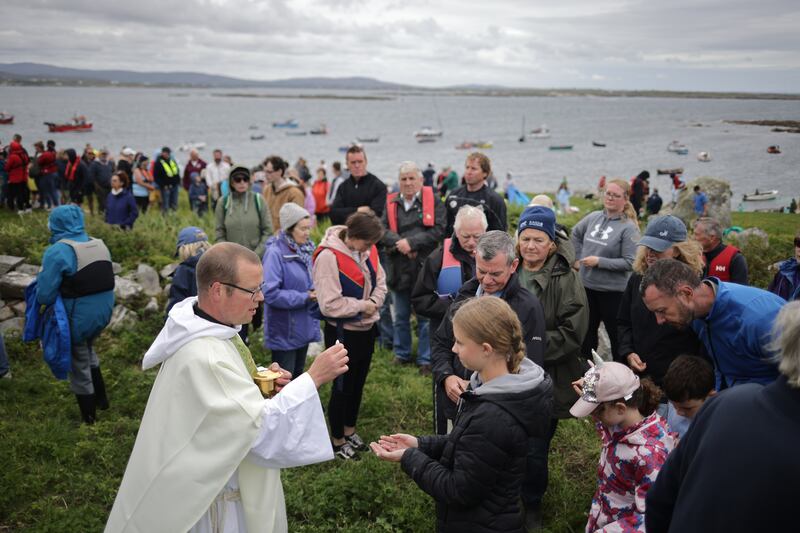 Fr Shane Sullivan, parish priest from Carna, Co Galway, celebrates mass on St MacDara’s Island for the festival. Photograph: Chris Maddaloni/The Irish Times