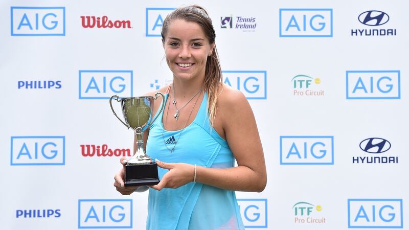 England’s  Jodie Burrage of England with the AIG Ladies Irish Open  trophy. Photograph: Matt Browne/Sportsfile