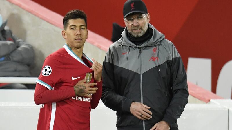 Roberto Firmino and Jürgen Klopp: ‘Bobby plays something like 12 instruments in our orchestra. He’s very important.’ Photograph: Peter Powell/Pool/Getty Images