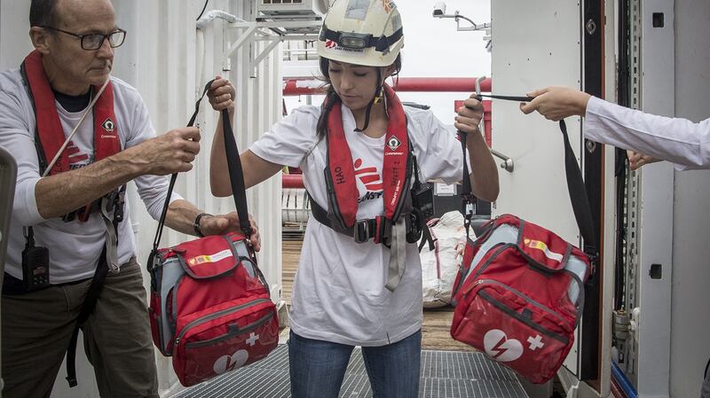 MSF Logistician Shaun Cornelius and Humanitarian Affairs Officer, Yuka Crickmar, move the Automated External Defibrillators (AED) from the storage to the medical clinic. The AED is used for resuscitation of patients in cardiac arrest.