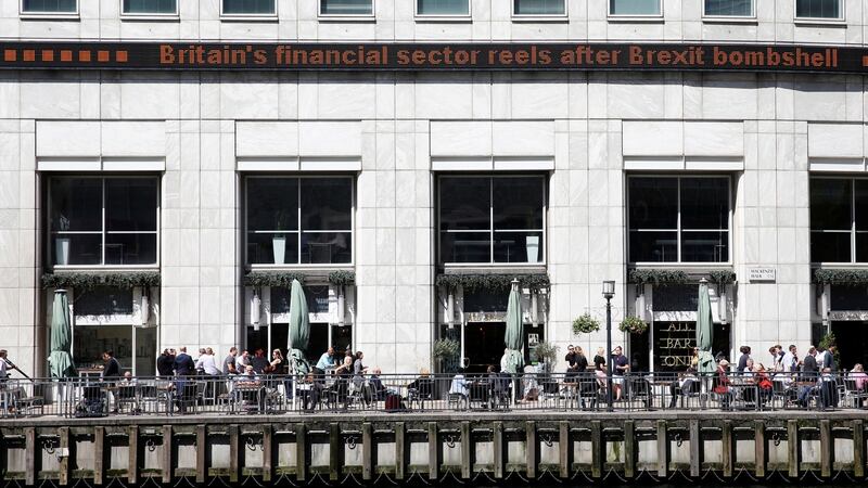 People eat and drink in the sunshine in London’s Canary Wharf financial centre June 24th 2016 after Britain voted to leave the European Union. Photograph: Russell Boyce/Reuters