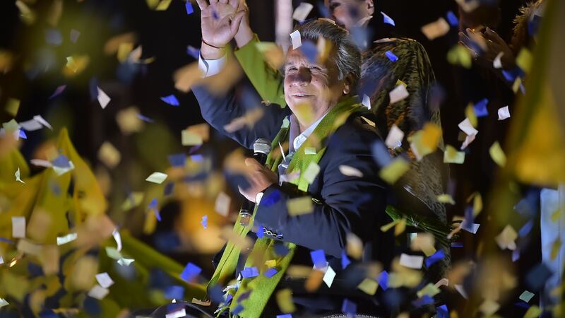 Ecuadorean presidential candidate of the ruling Alianza PAIS party, Lenin Moreno, waves to his supporters as they waited for the final results of the run-off election in Quito on Sunday. Photograph:  Rodrigo Buendia/AFP/Getty Images