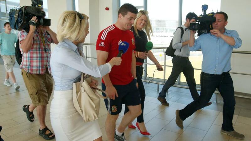 Brian O’Driscoll runs the media gauntlet at Dublin airport on his return from the British and Irish Lions tour to Australia. Photograph: Donall Farmer/Inpho