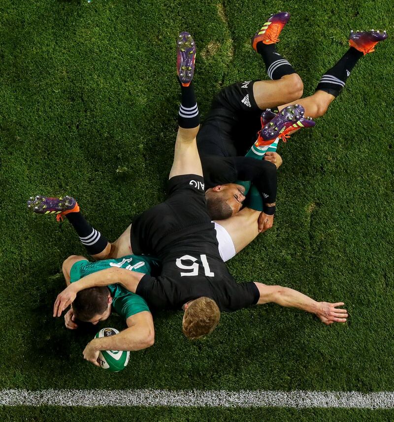 Ireland’s Jacob Stockdale scores a try despite the close attentions of New Zealand’s Damian McKenzie and Aaron Smith in November. Photograph: Inpho/Tommy Dickson
