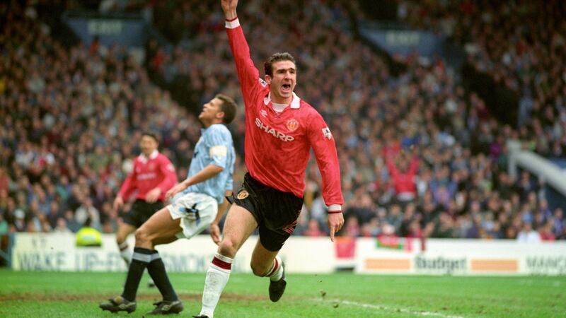 Cantona during his playing days at Old Trafford. File photograph: PA