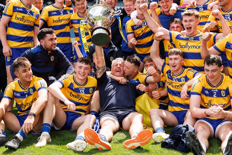 The Roscommon team and manager Kevin Sammon celebrate with the Nickey Rackard Cup after beating Mayo. Photograph: Ben Brady/Inpho