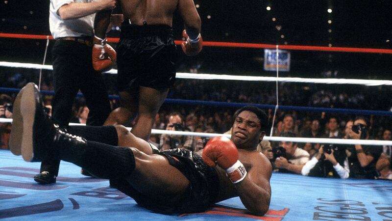 Trevor Berbick is knocked down by Mike Tyson during their heavyweight  fight at Hilton Hotel in Las Vegas in November 1986. Photograph: The Ring Magazine via Getty Images