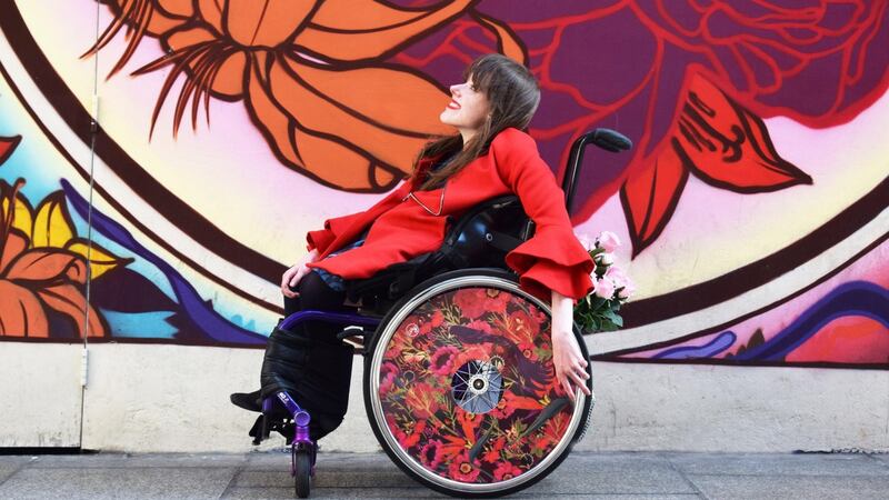 Isabel Keane models a wheel cover designed by Jane Newland. Photograph: Ailbhe Keane