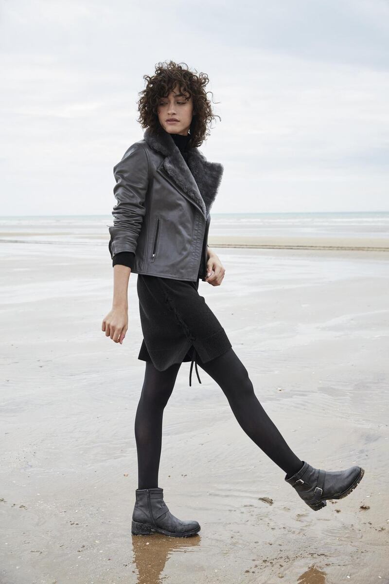 Sheepskin trim black leather biker jacket €584, knitted dress €168, leather biker boots €176