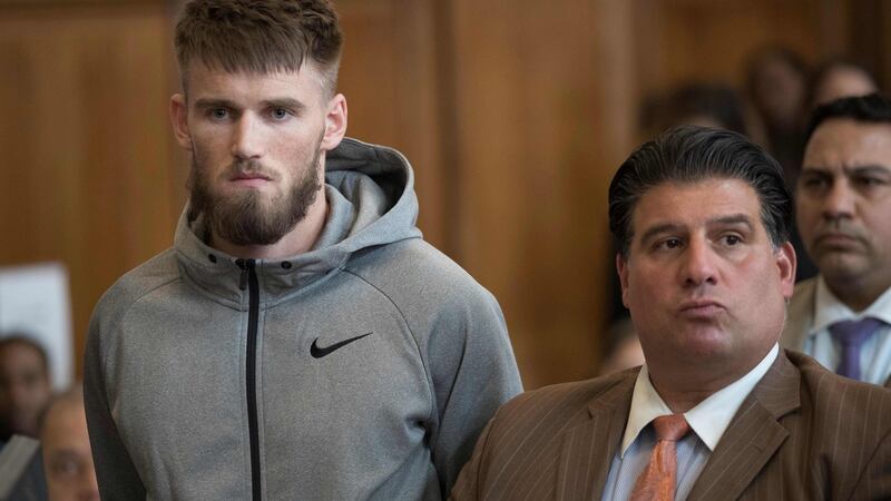 MMA fighter Cian Cowley (left) a friend of Ultimate fighting star Conor McGregor, stands with lawyer John Arlia during McGregor’s arraignment in Brooklyn. Photograph: Getty Images