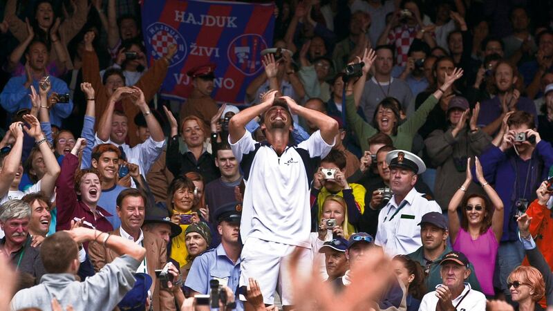 Goran Ivanisevic celebrates in the crowd on Centre Court after his win over  Pat Rafter. Photograph: Tom Jenkins/Getty Images