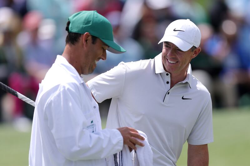 Happiness is  chipping in for eagle on the second hole during the third round. McIlroy shares the joy with caddie Harry Diamond. Photograph: Andrew Redington/Getty Images