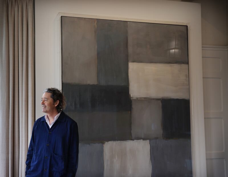 Park Hotel Kenmare owner Bryan Meehan stands beside 'Moorland' (2007), by Sean Scully, which hangs in the hotel's dining room