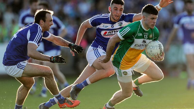 Offaly’s Bernard Allen takes on Robert Pigott and Gareth Dillon. Photograph: Laszlo Geczo/Inpho