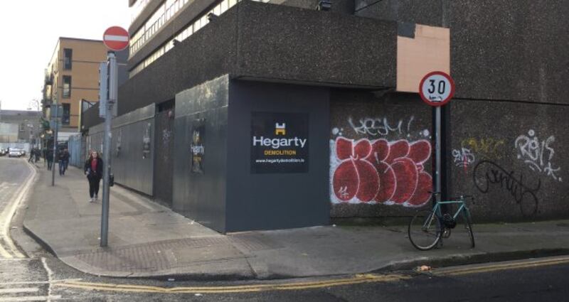 Hoarding was erected at Apollo House in early December by Hegarty Demolition. Photograph: Paddy Logue