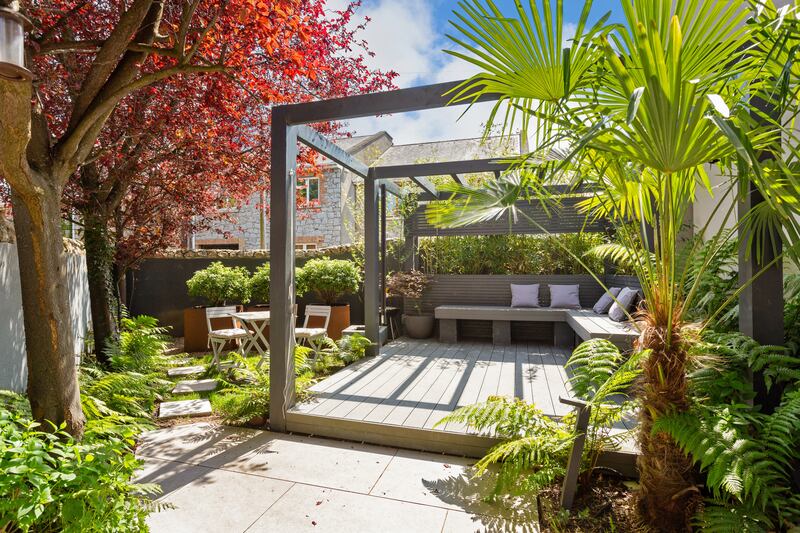 Garden with pergola and deck