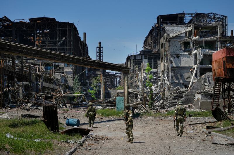 Russian soldiers patrol an area of the Metallurgical Combine Azovstal in Mariupol. Photograph: AP