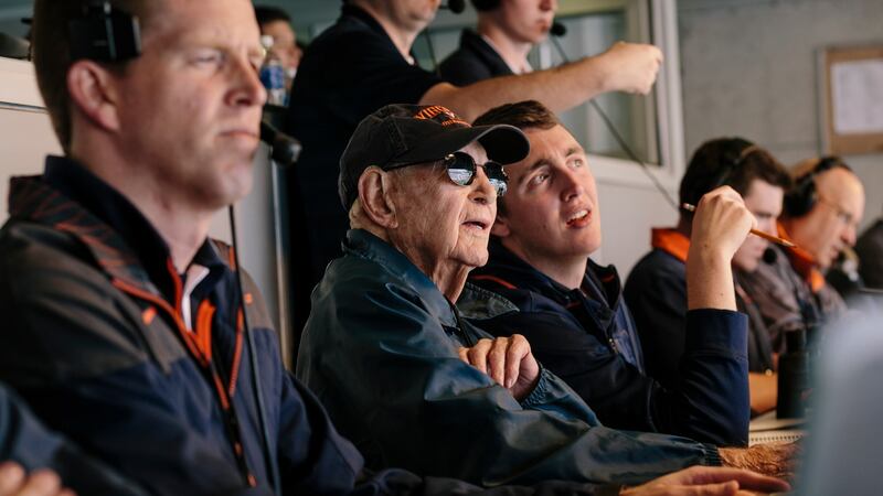 John Risher, 106, with student Daniel Buckley in the press box during a University of Virginia home football game  in Charlottesville, Virginia. Photograph: Lexey Swall/The New York Times)