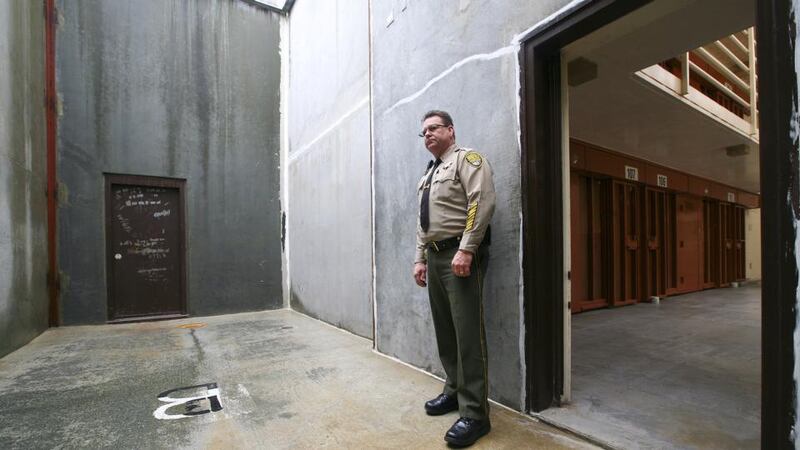 Solitary confinement: Lt Rick Graves stands in the inmates’ concrete exercise yard at the Pelican Bay State Prison near Crescent City in California. Photograph: Jim Wilson/The New York Times