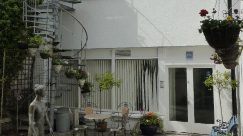 The two-storey office mews is let at €58,000