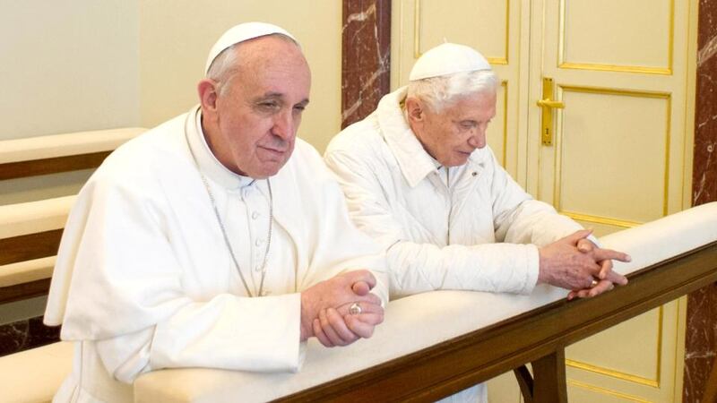 Pope Francis and his predecessor, Pope Emeritus Benedict XVI, pray together at the papal summer residence Castel Gandolfo. Photograph:  Servizio Fotografico L'Osservatore Romano via Getty Images