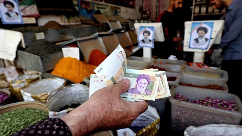 Iranians shop at the Molavi bazaar in southern Tehran. Photograph: Atta Kenare/AFP via Getty Images